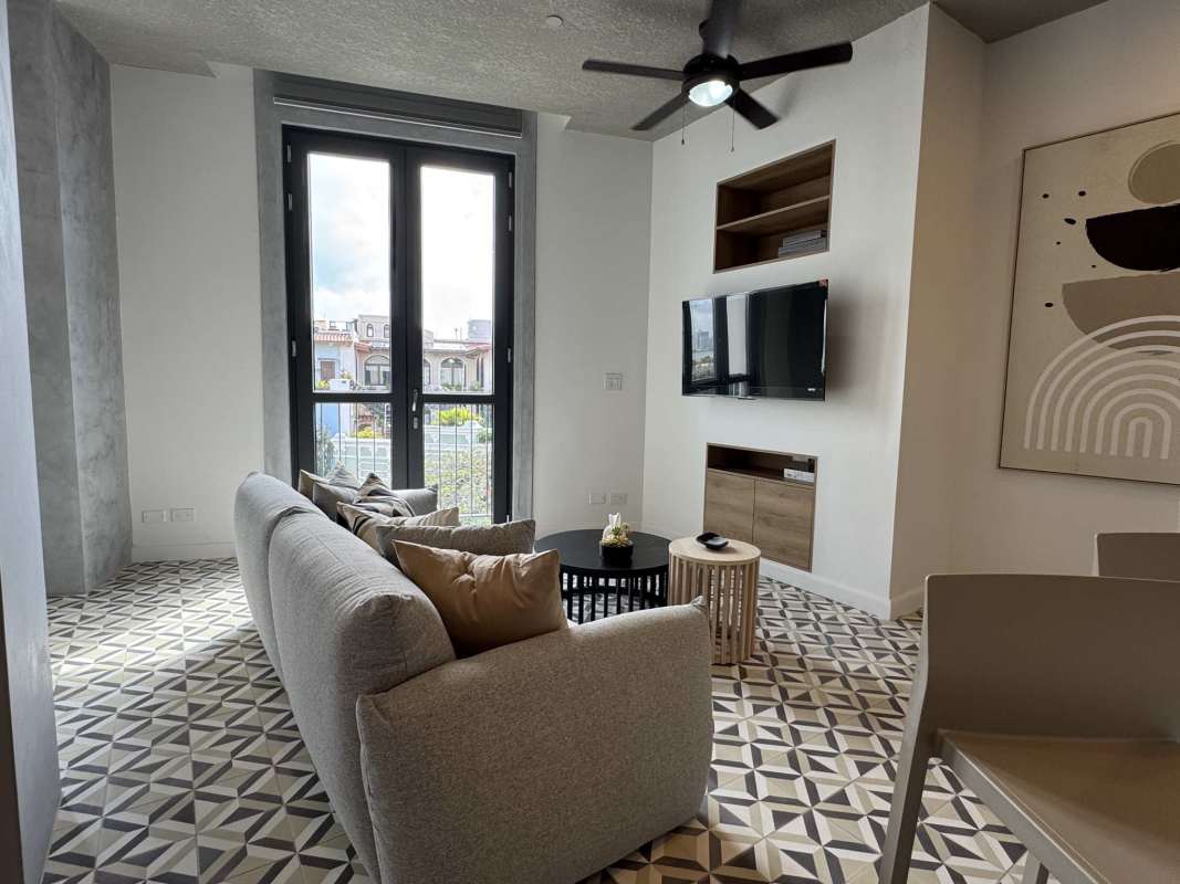 Contemporary kitchen with island, breakfast bar, and appliances in Plazuela de Alfaro Casco Viejo Panama City