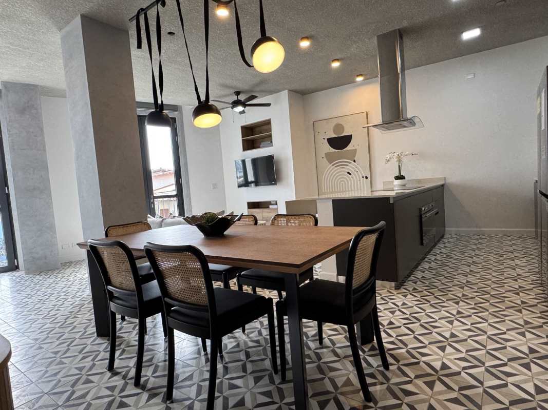 Bedroom furnished with wardrobe, AC, and large window at Plazuela de Alfaro Casco Viejo Panama