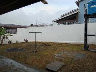 Laundry space with concrete sink and security bars in house for rent Puerto Caimito La Chorrera Panama