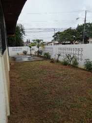Compact bathroom with tiled walls, pedestal sink and mirror in Puerto Caimito Residence La Chorrera Panama