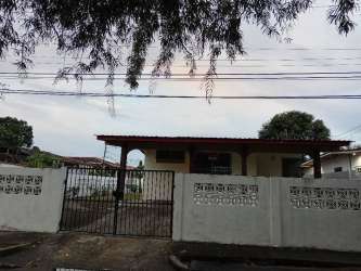 One-story house exterior with gated entrance in Puerto Caimito La Chorrera Panama