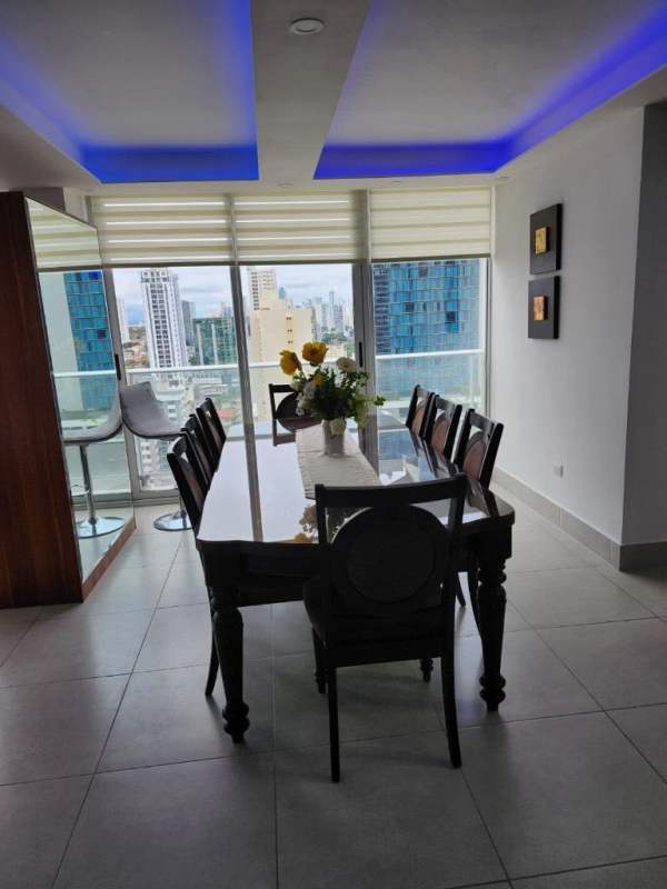 Modern kitchen with granite countertops, appliances, laundry area PH Cristal Park Panama City