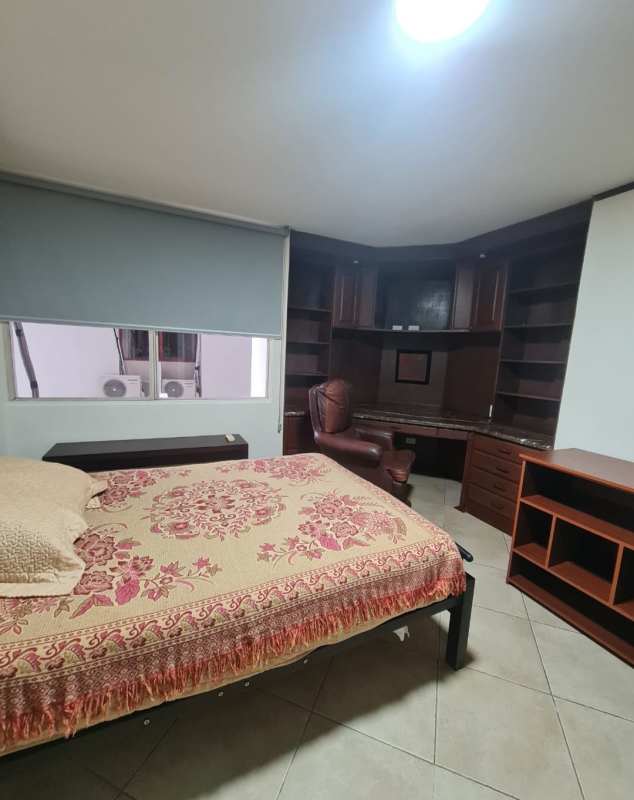 Modern kitchen with wood cabinetry, granite counters and appliances in PH Marbella Tower