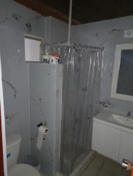 Bathroom with sink cabinet, mirror, shower curtain, toilet Chitré vacation rental