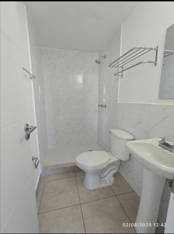 Modern residential building PH Athas with parking and signage in Villa Lucre Panama City