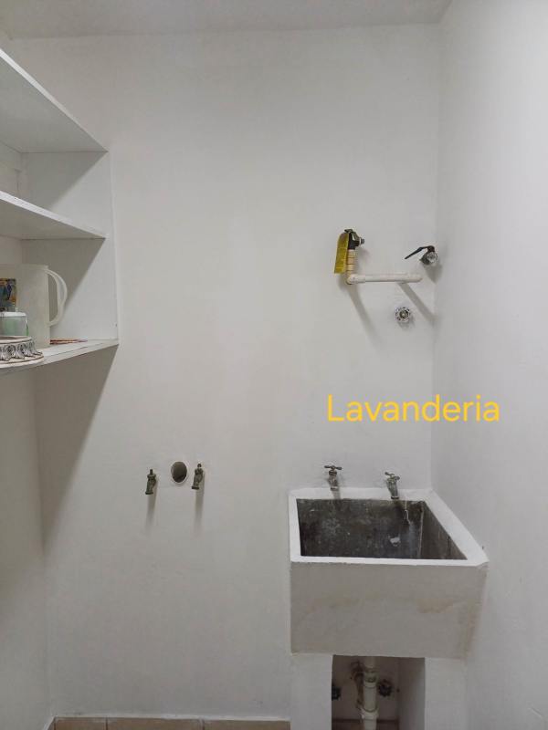 Laundry room with utility sink and storage shelves in PH Altos de la Colina Tower B Panama City