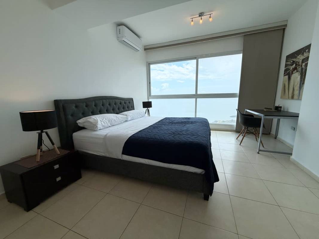 Master bedroom with panoramic ocean views, king-size bed, built-in closet at PH Vista del Mar Avenida Balboa