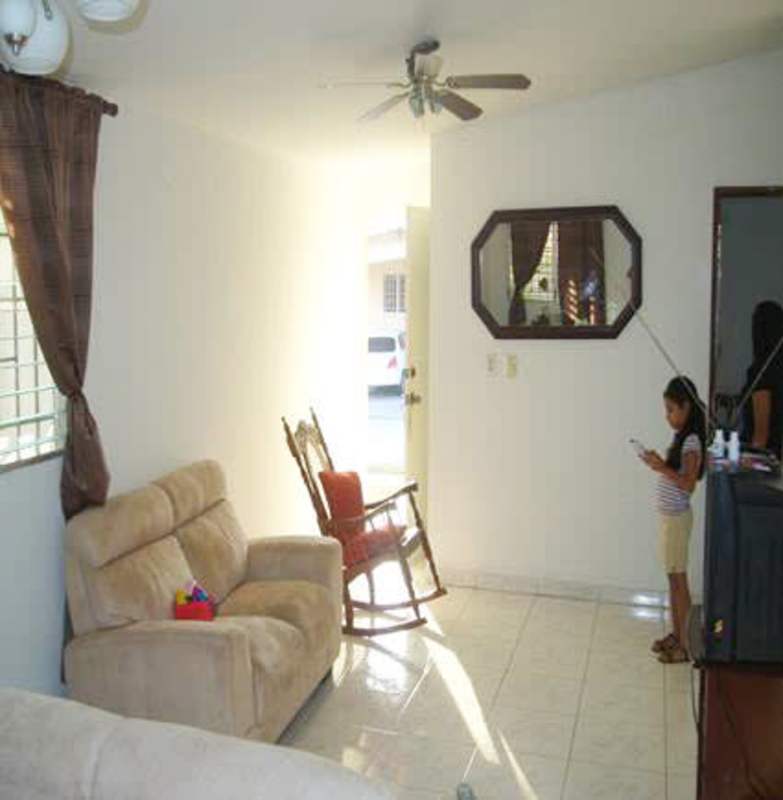Spacious living room with tile flooring, sofa, ceiling fan in Villa Zaita Panama City
