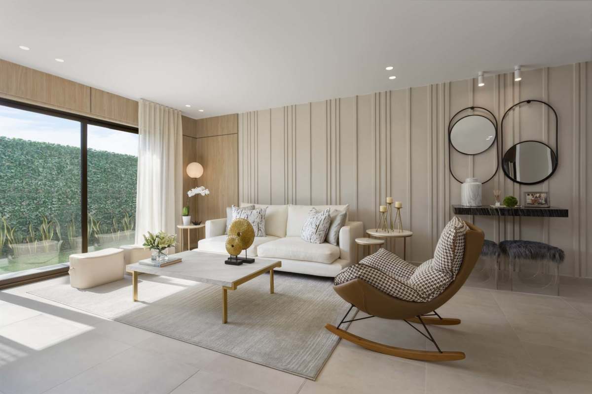 Minimalist light-toned living space with sofa and large window Costa Sur