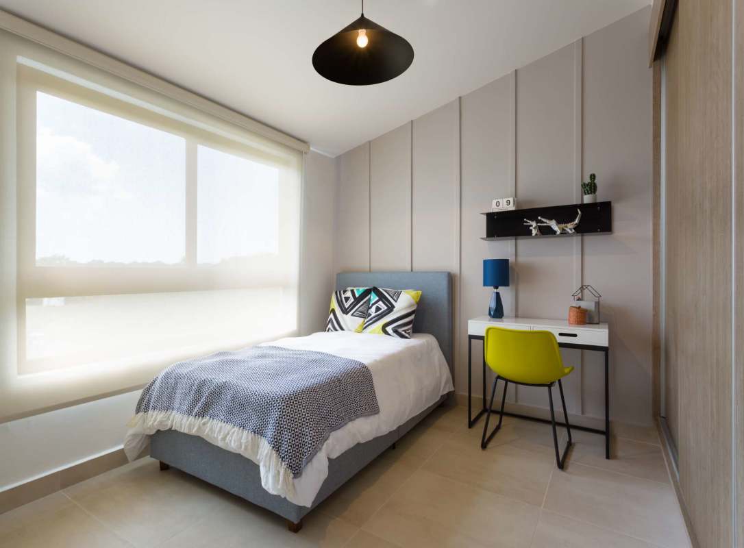 Single bed, large window, study space in bright minimalist bedroom Costa Sur