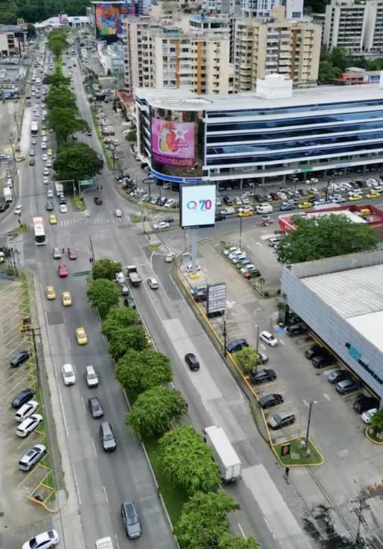 Aerial of busy city intersection with commercial buildings El Dorado Panama City
