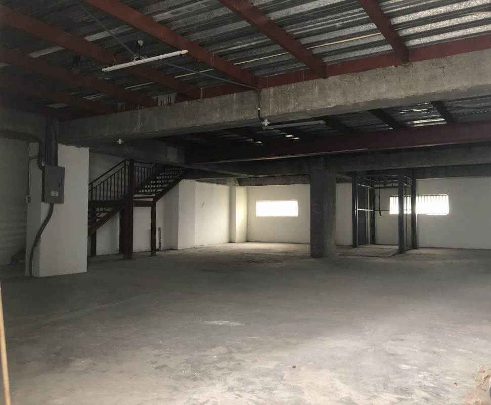 Concrete floor warehouse space with partition walls, exposed beams in El Dorado Panama