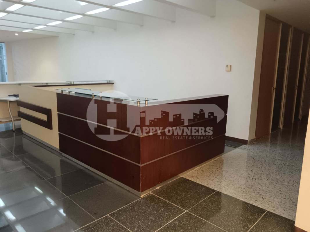 Reception area with glass partitions and stylish counter Torre de Las Americas premium office Panama City