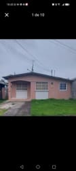 Front facade with pink walls, garage door, yard in Princesa Mía Vista Alegre Panama