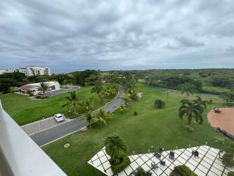 Spacious living room with glass doors to ocean view balcony in PH Perlamar Casamar San Carlos Panama