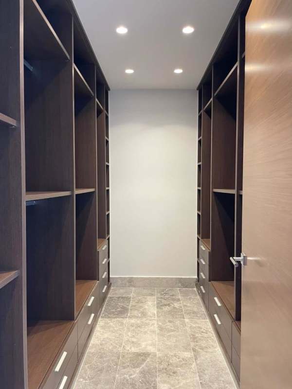 Open living room marble floors floor-to-ceiling windows city views Empire Residences Panama