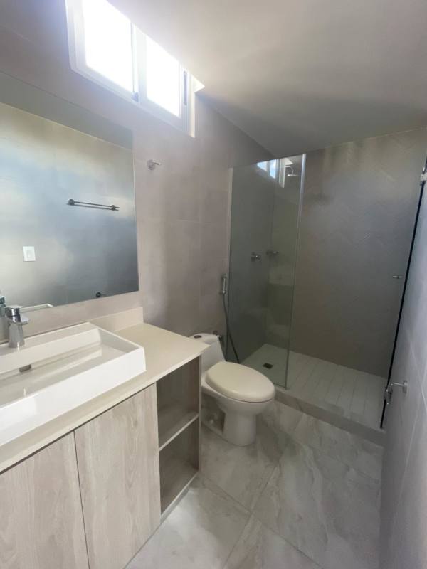 Bathroom with glass-enclosed shower, vanity, modern fixtures PH Luxor Panama City