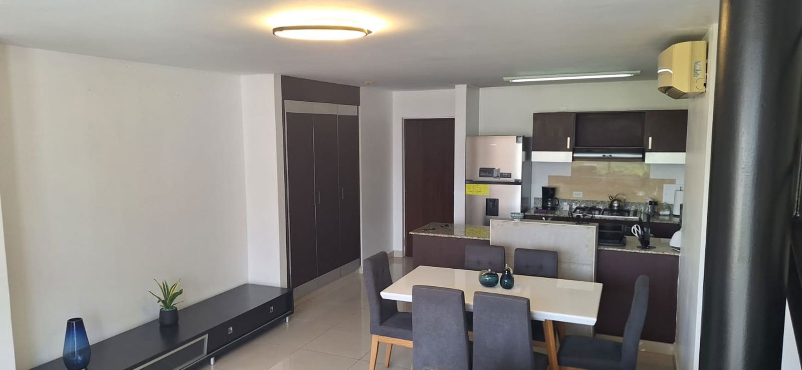Entry hall in furnished apartment at PH Bali Costa del Este Panama with console and decor