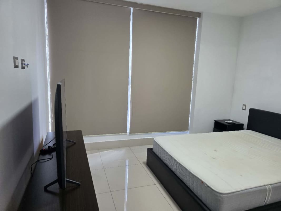 Minimalist bedroom with large window blinds and neutral decor PH Bali Panama