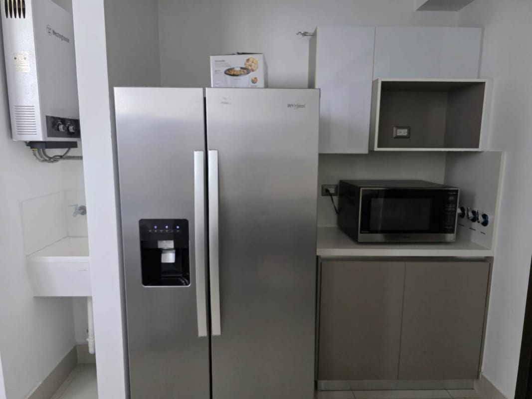 Bedroom corner with TV unit and large window minimalist decor PH Bali Panama