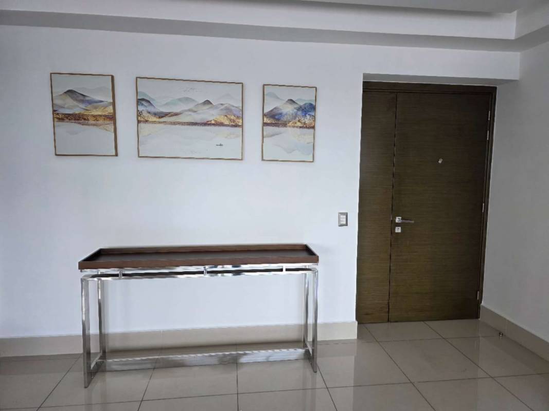 Rooftop tennis court with fence city skyline in PH Bali Costa del Este Panama