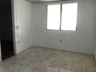 Simple bathroom with pedestal sink walk-in shower tiled walls La Chorrera Panama