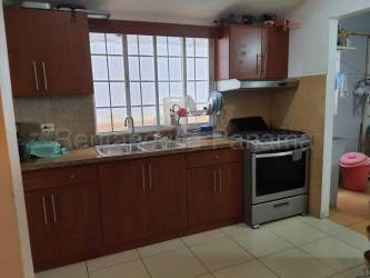 Dining room connected to kitchen with ceiling fan and light in duplex La Chorrera