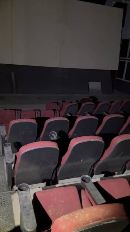 Commercial lobby space with decorative wooden framed glass panels inside cinema complex Panama