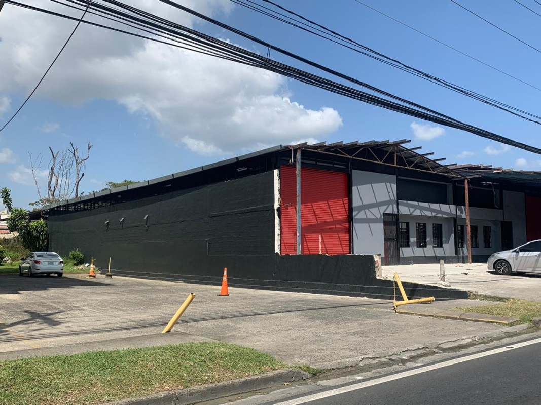 Functional office with desk, plant, AC, office equipment inside warehouse Panama