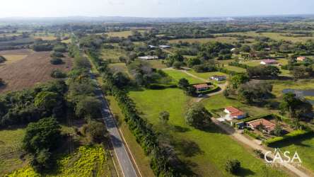 Rural residential community view with scattered houses green landscape Equus Village Pedasi Panama
