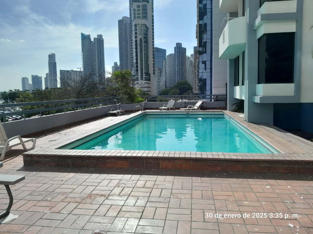Outdoor swimming pool with lounge area at PH La Gaviota Avenida Balboa Panama