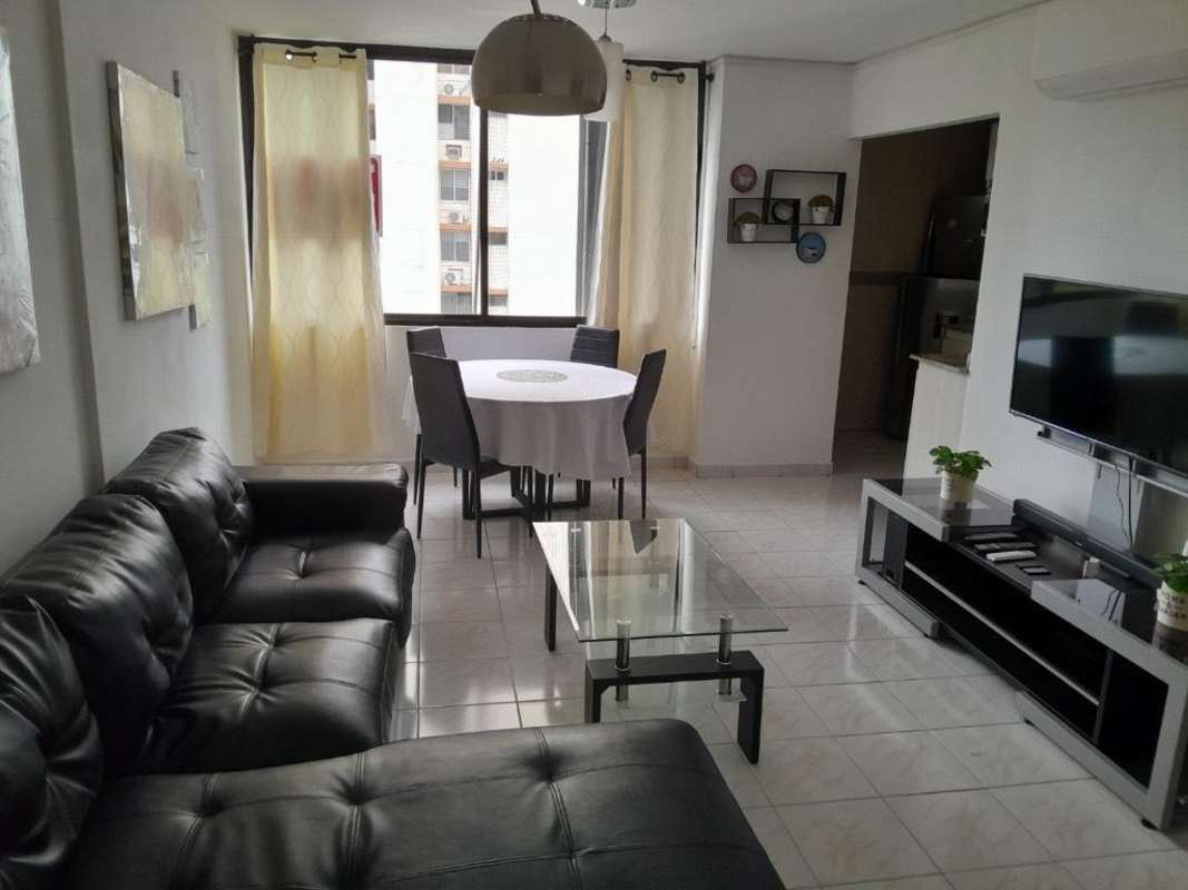 Open concept living dining space with balcony view in PH Ibiza condo Panama