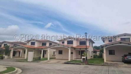Front view two-story home Mediterranean design with carport La Chorrera Panama