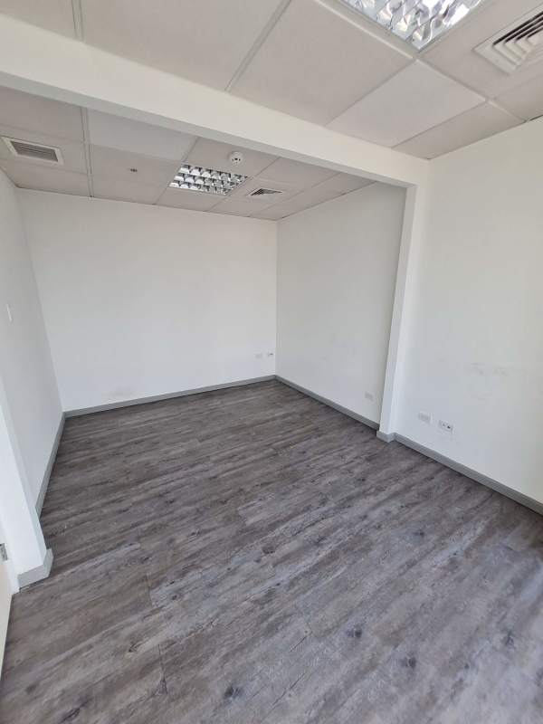 Large empty commercial office space with wood flooring and white walls PH Ocean Business Plaza Panama