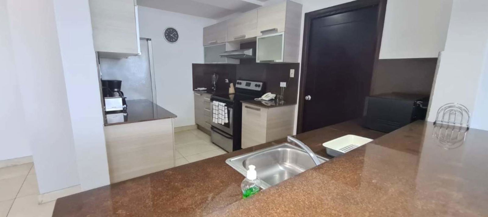 Furnished living area with sectional sofa and panoramic views PH Villa del Mar Panama