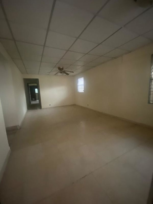Open living space with tiled floors ceiling fan in house for sale Linda Vista Condado del Rey Panama