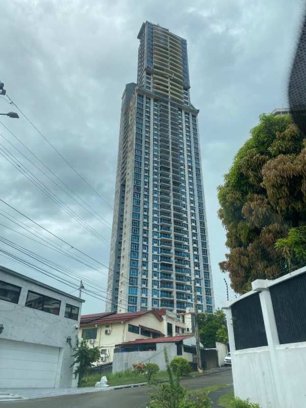 Modern dining space with sofa and open hallway at PH Elite 500 Panama