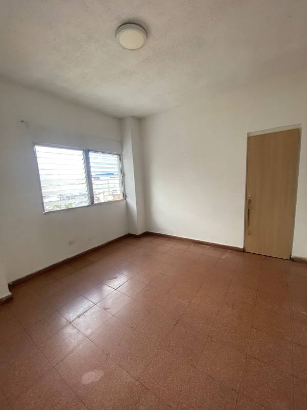 Spacious bedroom with natural light louvered windows in PH Analisa Carrasquilla Panama City