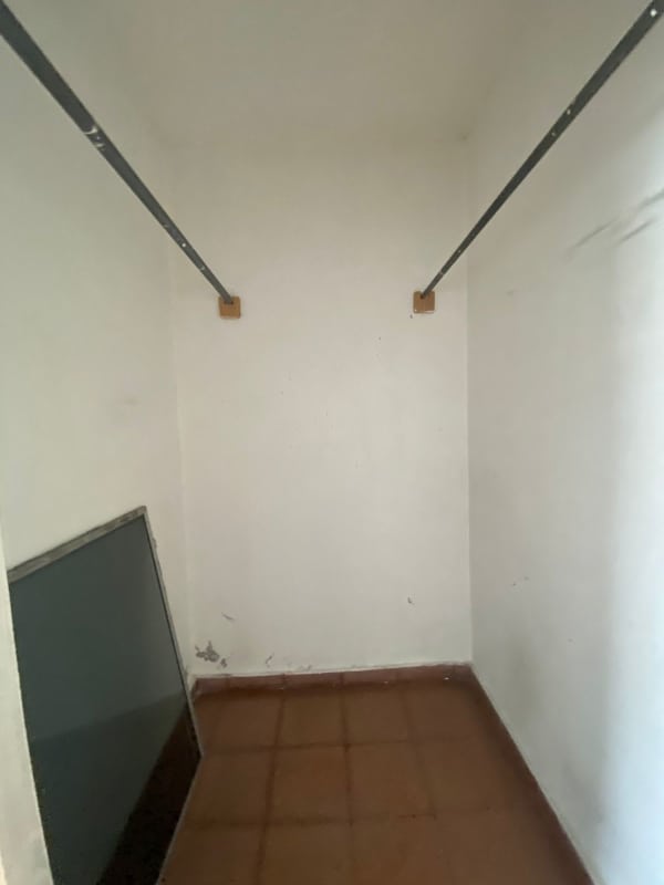 Empty walk-in closet with tile flooring in 1 bedroom apartment PH Analisa