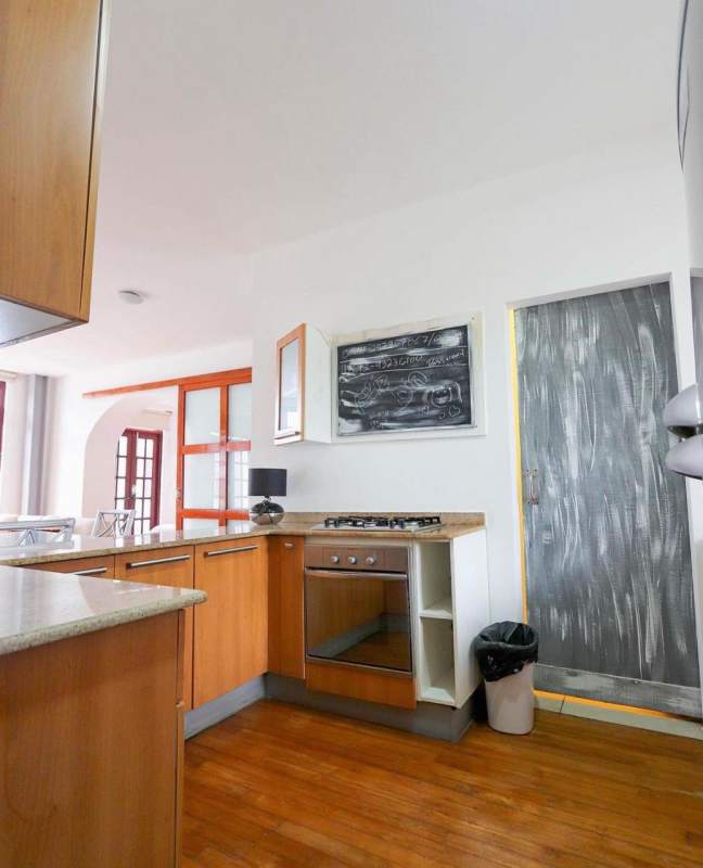 Furnished bedroom with wood floors, French balcony, AC, and city views in PH Star & Herald Casco Viejo