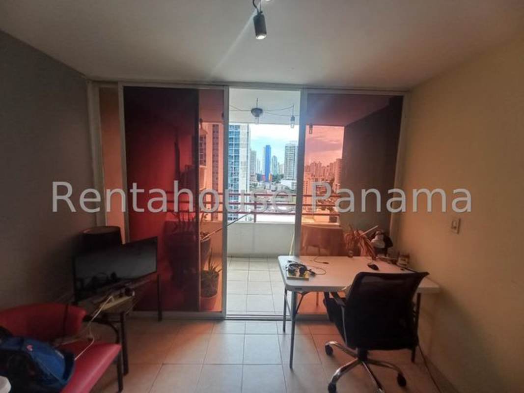 Living-dining area with tile floor, large windows, access to balcony in PH Vista Hermosa near Via España Panama