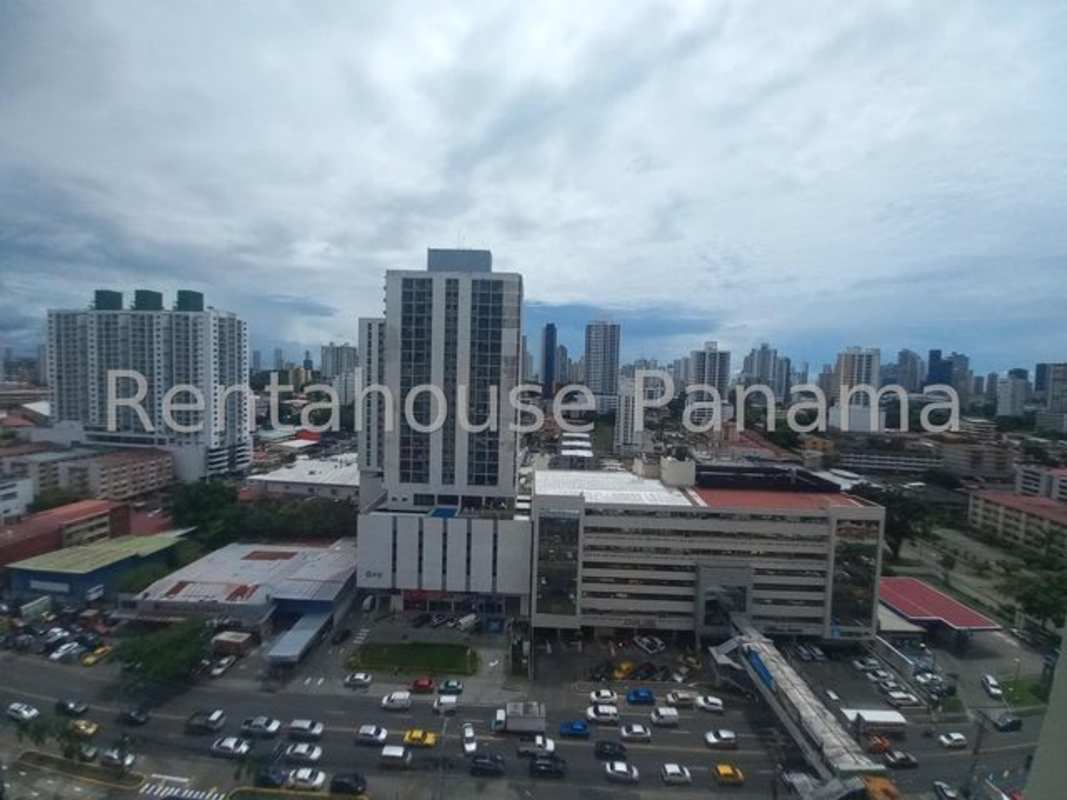 Semi-open kitchen with ceramic counters, breakfast bar, tile floor in apartment Panama City