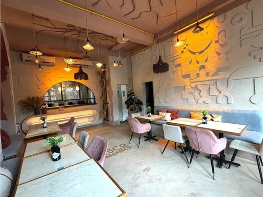 Modern eclectic restaurant dining area inside colonial commercial property Casco Viejo
