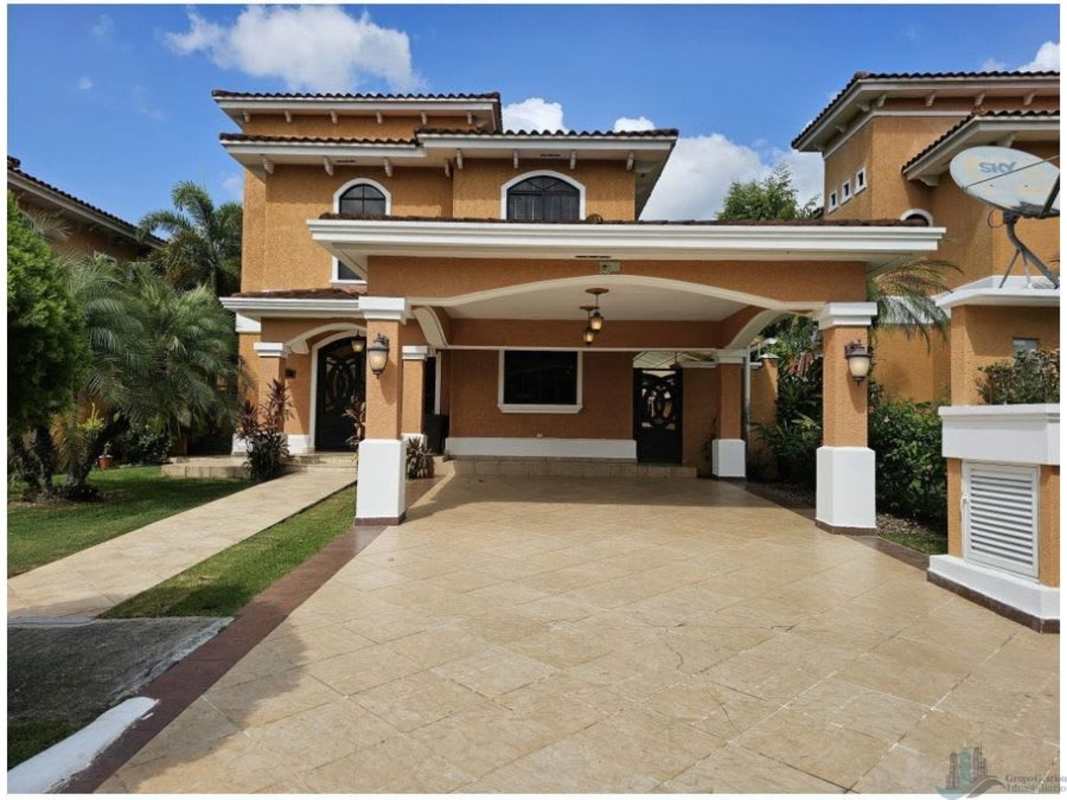 Mediterranean style staircase with iron railing and high ceiling in Clayton Panama house