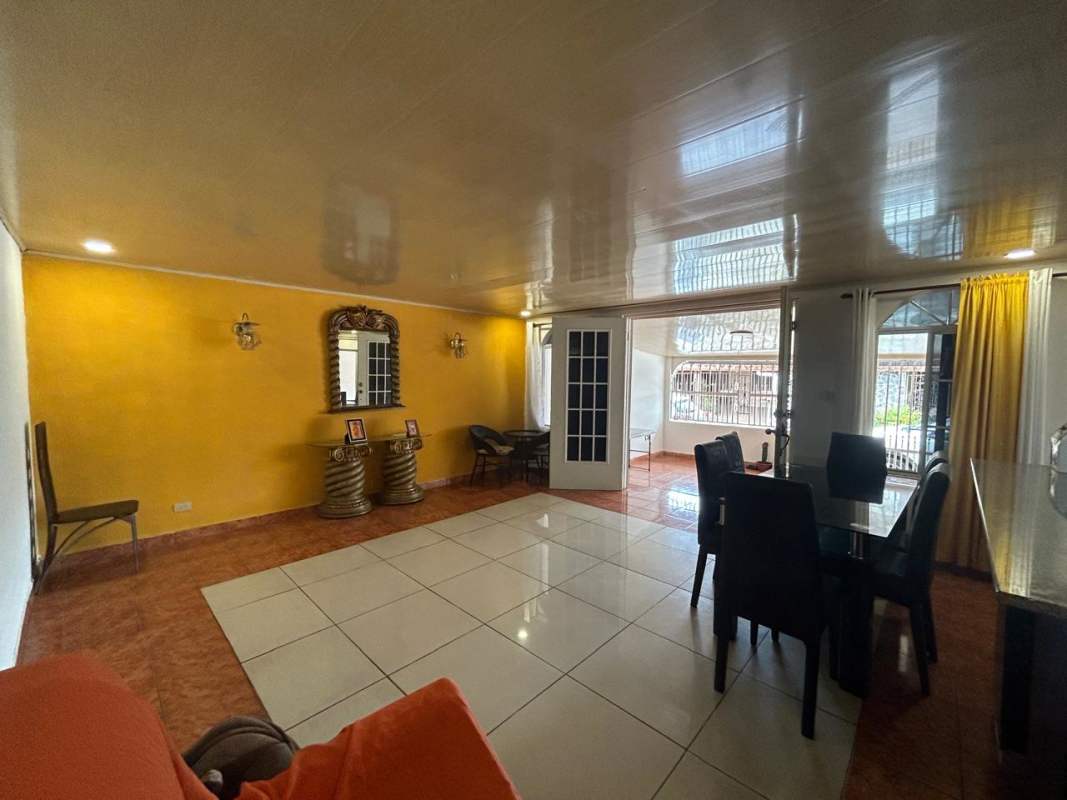 Wide hallway with tiled floor, shelving and hooks at Don Bosco residential house Panama