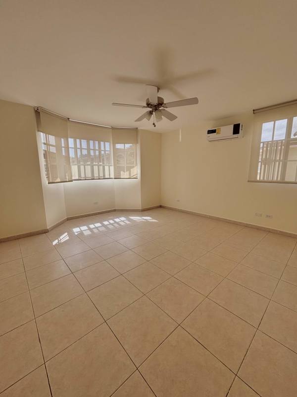 Large walk-in closet with built-in shelving in master bedroom of Clayton home for sale