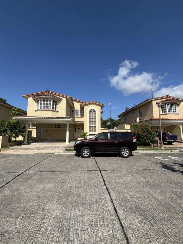 Spacious living and dining room with ceramic tile floors and large windows in house for sale in Clayton Panama
