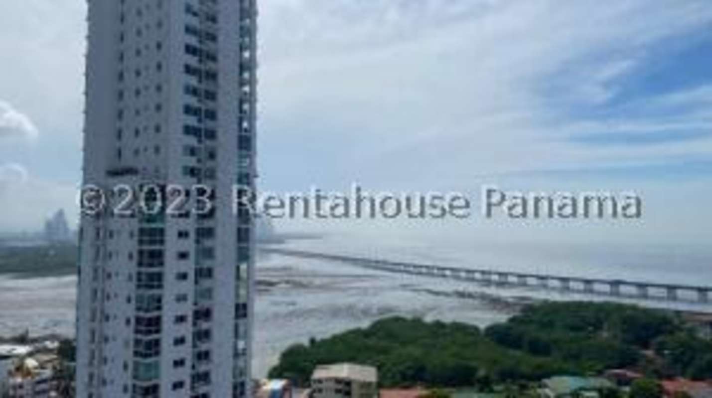 Contemporary dual sink vanity bathroom with large mirror at Victory Wellness Tower Panama
