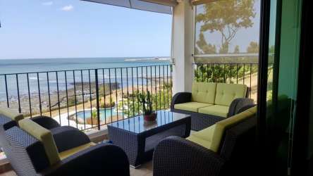 Oceanfront balcony with hammock and chairs La Ensenada Resort San Carlos Panama