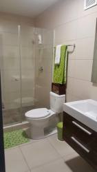 Bathroom with glass shower, modern vanity in La Ensenada Beach Resort San Carlos Panama
